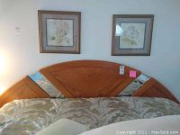 Front view of king size bed frame headboard showing oak finish and mirrored accents