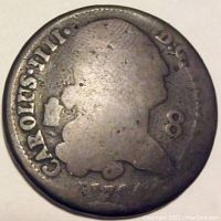 Obverse side of 1794 Spanish Colonial 8 Maravedi coin showing profile portrait of King Carlos IIII and denomination 8, with visible wear and tarnish.