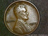 Obverse of 1909 VDB Lincoln Wheat Cent showing Abraham Lincoln profile, date 1909, IN GOD WE TRUST and LIBERTY inscriptions.