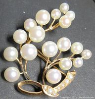 Front view showing floral arrangement of cultured pearls on 14K gold stems