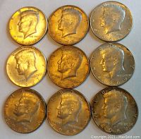 Nine Kennedy Half Dollar coins arranged in three rows of three showing obverse profiles and dates.