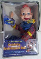 Howdy Doody doll inside clear zip-up carry case with front tag visible showing doll details and usage instructions.