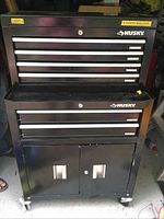 Front view of black Husky top chest and rolling cabinet on casters