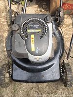 Top-down image of black Murray gas lawn mower showing engine cover with 6.0 gross torque rating and pull start mechanism.