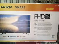 Front of original Sharp Smart TV box showing model details and branding