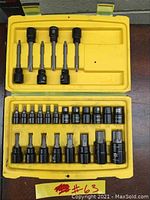 Open view of Stanley black chrome socket set with all pieces arranged in yellow case.