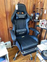 Full front view of black GTPLAYER gaming chair showing overall appearance and condition