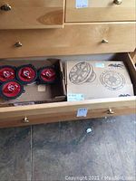 Four Sony red cone speakers in drawer and white box for Wet Sounds XS-65i-S speakers.