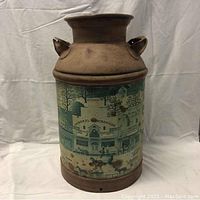 Photo of antique milk jug showing the General Merchandise and town scene print.