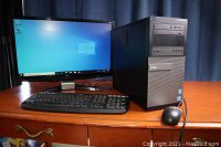 Full setup showing tower, monitor, keyboard and mouse on desk