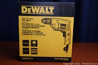 Front of box showing DeWalt 3/8 inch (10 mm) VSR drill specs, 7 amp motor, 0-2800 rpm speed, and image of drill.