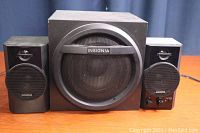 Front view of the Insignia 2.1 Bluetooth desktop speaker system showing the subwoofer and two satellite speakers.