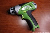 Side view of the green and black Power Smith cordless screwdriver body showing handle and trigger details.