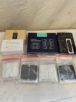 Full overview photo of the lot showing all devices and electrode pads laid out