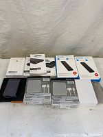 Overview of lot with multiple power banks and packaging displayed on table.