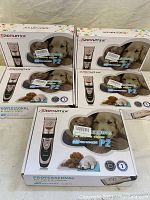 Five boxed BaoRun Professional P2 Pet Electric Clipper kits stacked