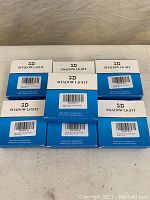 Seven 3D Shadow Light boxes arranged in two rows, showing front labels and packaging.