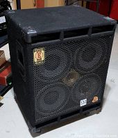 Angled full view of the black carpeted Eden speaker cabinet with metal grille and corner protectors.