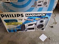 Box featuring Philips Magnavox branding and model FW386C with product details such as 50W output, 4 speaker surround, digital tuning, bass boost, and other features.
