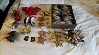 Top wide shot showing all birds and star ornaments laid out on cloth surface