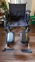 Front view of Drive wheelchair showing padded seat and leg rests with footplates.