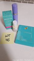 Four skin care items displayed: Pure Code Argan Oil Rainforest Mist box, Tatcha Luminous Dewy Skin Mist bottle with purple cap, Fast Beauty Company teal box, and small white bottle of Kiehl's creme.