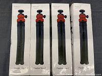 Four boxed Dodocool flexible tripods in white packaging with image of tripod on front.