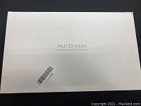 White retail box of AUTO-VOX Solar Wireless Digital Reversing System showing some wear.