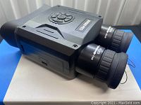 Device angled side view showing overall condition and control buttons