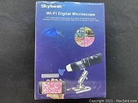 Front of the retail box showing Skybasic Wi-Fi Digital Microscope branding and compatibility info.