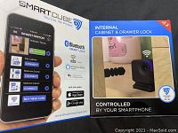 SmartCube lock marketing pamphlet displaying smartphone app control and features.