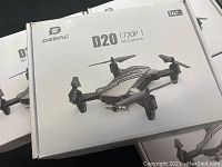 Three Deerc D20 drone retail boxes stacked flat
