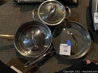 Photo of all three pots and pans with lids showing overall condition and style.