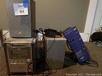 Photo of JVC mini stereo system with two speakers and power cord.