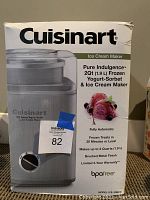 Front of the Cuisinart box showing ice cream maker image and main features: 2 quart capacity, fully automatic, brushed metal finish, BPA free, model ICE-30BCC.