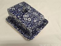 Cheese dish with lid showing blue and white floral pattern
