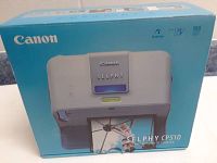 Box of Canon Selphy CP510 Compact Photo Printer showing front with product image and features.