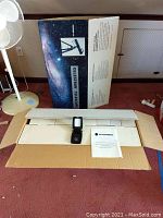 Boxed Celestron telescope with protective foam inserts, manual, and optic finder scope.
