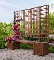 Wooden planter bench with trellis back and two planter boxes on either side displayed outdoors on stone patio.