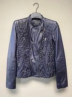 Front view of navy blue leather jacket showing embossed patterns, zipper, collar, and pocket details.