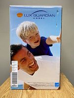 Front of retail box showing Lux Guardian Angel branding with photo of man and child