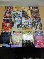 Top view of 15 assorted comic books laid out in three rows, showing cover art and titles.