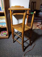 Photo showing the vintage child's school desk and chair, capturing the overall shape, size, and wood finish.