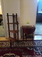 Overview showing gate-leg table and tiered corner stand