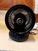 Front view of the Westinghouse black oscillation fan showing the 9-inch blade within a circular grill.