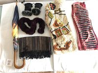 Lot overview showing umbrella, knit shawl, rabbit fur gloves and scarf, along with knit sweater.