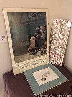 Framed poster of The Bath by Jean Leon Gerome with visible scene of bathhouse, accompanied by two other artworks including a totem-style graphic piece and a matted print.