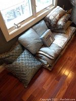 Set including folded comforter, stacked decorative pillows, and packaged Martex duvet cover set.