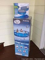 Bestway Steel Pro Frame pool box stacked with Summer Waves pool cover box.
