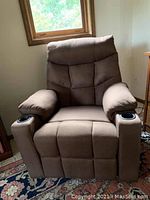 Front view of brown fabric electric recliner chair with cup holders